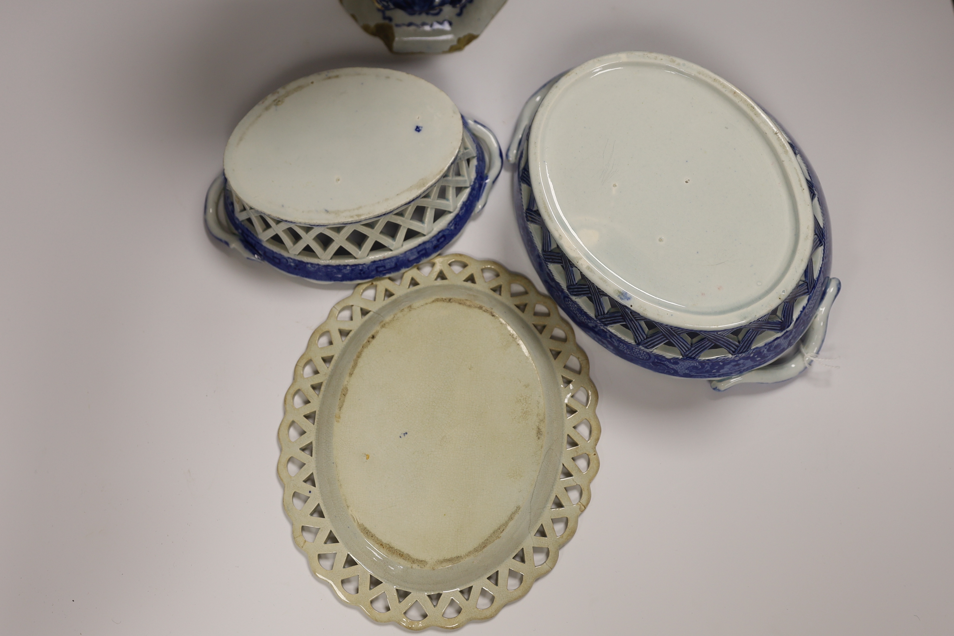 An 18th century hexagonal Delft vase, two pearlware blue and white baskets and a similar dish, tallest 27cm